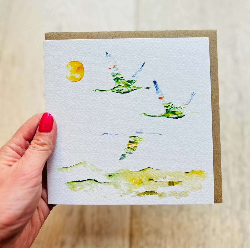 Swans in Flight 'Follow the Sun' Greeting Card by Sarah Epsom